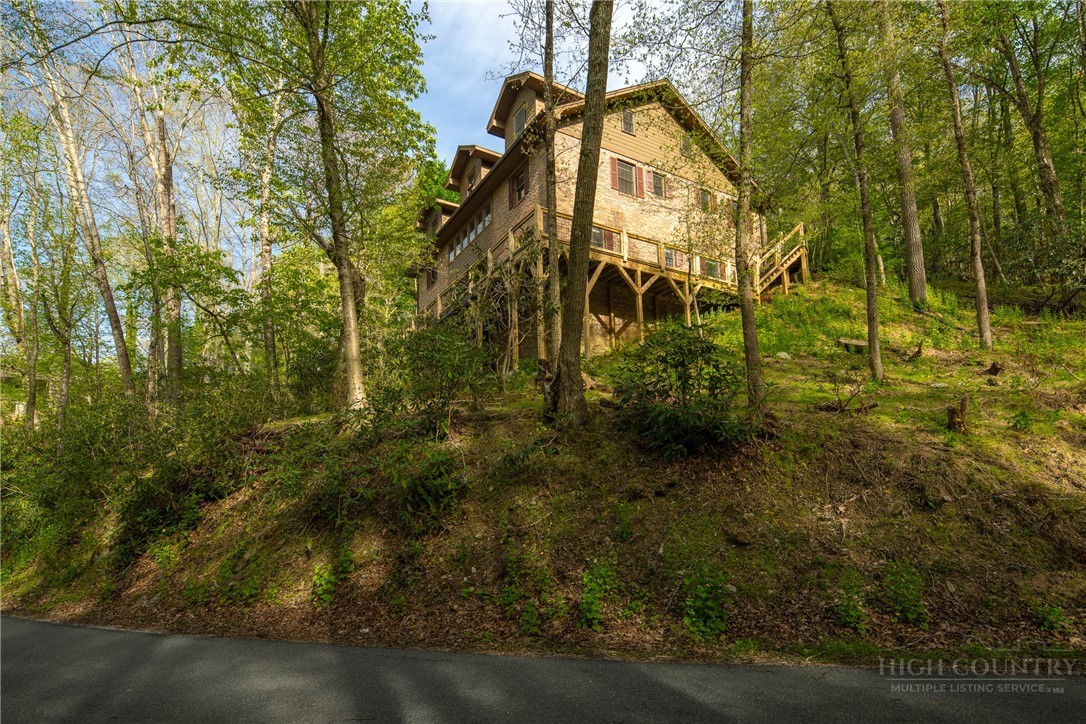 Covered entry and stained-wood siding at 239 Eagle Drive.